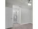 Bright bedroom showcasing a walk-in shower and natural light, with wood-look floors at 7360 Ulmerton Rd # 17D, Largo, FL 33771
