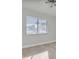 Bedroom with a ceiling fan, a large window, and attractive flooring at 7360 Ulmerton Rd # 17D, Largo, FL 33771