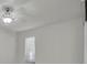 Bright bedroom featuring a ceiling fan and window with blinds at 7360 Ulmerton Rd # 17D, Largo, FL 33771