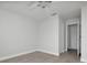 A cozy bedroom with wood-look floors, a ceiling fan, and a closet at 7360 Ulmerton Rd # 17D, Largo, FL 33771