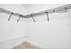 Walk-in closet with wire shelving for organized storage and wood-look floors at 7360 Ulmerton Rd # 17D, Largo, FL 33771