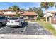 Charming single-story home with a red tile roof, palm trees and dedicated parking at 7360 Ulmerton Rd # 17D, Largo, FL 33771