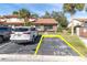 Charming single-story home with a red tile roof, palm trees and dedicated parking at 7360 Ulmerton Rd # 17D, Largo, FL 33771