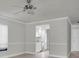 Open concept living area showcasing a window, updated lighting, and an adjacent kitchen area at 7360 Ulmerton Rd # 17D, Largo, FL 33771