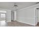 Inviting living room featuring neutral walls, wood-look floors, and open access to other living areas at 7360 Ulmerton Rd # 17D, Largo, FL 33771