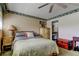 Bedroom featuring natural light, a ceiling fan, and access to an en-suite bathroom at 7425 Bay Island S Dr # 203, South Pasadena, FL 33707