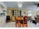 Traditional dining room with display cabinet, tile floors, and comfortable seating arrangement at 7425 Bay Island S Dr # 203, South Pasadena, FL 33707