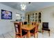 Charming dining area showcasing a chandelier, decorative wall art, and adjacent kitchen access at 7425 Bay Island S Dr # 203, South Pasadena, FL 33707