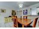 Bright dining area featuring a wood table, and seamless transition to other living spaces at 7425 Bay Island S Dr # 203, South Pasadena, FL 33707