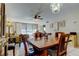 Inviting dining room featuring wood table, chandelier, and comfortable access to the living room at 7425 Bay Island S Dr # 203, South Pasadena, FL 33707