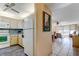 Efficient kitchen featuring white appliances, wood cabinets, and open view into dining room at 7425 Bay Island S Dr # 203, South Pasadena, FL 33707