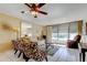 Comfortable living room offers tile floors, water views, and ample seating at 7425 Bay Island S Dr # 203, South Pasadena, FL 33707