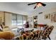This is a cozy living room with tile floors and a view of the water outside the window at 7425 Bay Island S Dr # 203, South Pasadena, FL 33707
