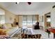 Bright living room features tile floors, a large window with water views, and comfortable seating at 7425 Bay Island S Dr # 203, South Pasadena, FL 33707