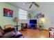 Inviting living room with neutral walls, wood-look floors, and a cozy entertainment area at 7425 Bay Island S Dr # 203, South Pasadena, FL 33707
