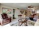 This is a cozy living room with tile floors and furniture with a painting on the wall at 7425 Bay Island S Dr # 203, South Pasadena, FL 33707