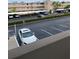 Exterior view of the building and parking lot, with trees and shrubs at 7425 Bay Island S Dr # 203, South Pasadena, FL 33707