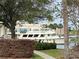View of the waterfront with a large boat docked in front of the building at 7425 Bay Island S Dr # 203, South Pasadena, FL 33707