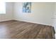 This bedroom has lovely wood flooring and a light and airy atmosphere due to the natural light at 7526 Needle Leaf Pl # 29, Tampa, FL 33617