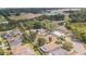 Aerial view of home at 8908 Hixon Road with nearby athletic field and pond at 8908 Hixon Rd, Tampa, FL 33626