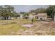 A backyard features a concrete slab, offering potential for outdoor living and recreation at 8908 Hixon Rd, Tampa, FL 33626