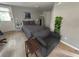 Relaxing bedroom features wood-look tile floors, a large bed, and a comfortable chair at 943 7Th N St, St Petersburg, FL 33701