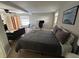 A furnished bedroom includes a full bed and a small breakfast table at 943 7Th N St, St Petersburg, FL 33701