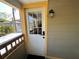 Exterior view of front door with glass panel and digital lock at 943 7Th N St, St Petersburg, FL 33701