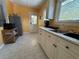 Efficient kitchen layout featuring bright cabinetry, natural light, and modern sink at 943 7Th N St, St Petersburg, FL 33701