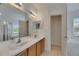 Bathroom includes dual sinks and a large mirror at 10048 Creek Bluff Dr, Riverview, FL 33578