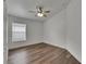 Bedroom showcasing neutral walls and wood-look floors at 10048 Creek Bluff Dr, Riverview, FL 33578