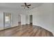 Bright bedroom showcasing wood-look floors and access to a patio at 10048 Creek Bluff Dr, Riverview, FL 33578