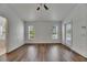 Well-lit bedroom features wood-look floors and a window providing natural light at 10048 Creek Bluff Dr, Riverview, FL 33578