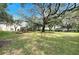 Large grassy area with playground equipment and mature trees at 10048 Creek Bluff Dr, Riverview, FL 33578