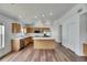 Open kitchen featuring wood cabinets, stainless steel appliances, and a center island at 10048 Creek Bluff Dr, Riverview, FL 33578