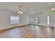 Bright living room boasting hardwood floors and abundant natural light from large windows at 10048 Creek Bluff Dr, Riverview, FL 33578