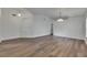 Spacious living room featuring wood-look floors and plenty of natural light at 10048 Creek Bluff Dr, Riverview, FL 33578