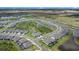 A beautiful aerial view of the neighborhood showcasing the well-maintained homes and community lakes at 10418 Spring Tide Way, Parrish, FL 34219