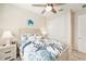 Comfortable bedroom featuring a coastal theme, carpet, and nautical decor at 10418 Spring Tide Way, Parrish, FL 34219
