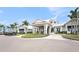 Exterior of a bright, modern clubhouse with well-manicured landscaping and porte cochere at 10418 Spring Tide Way, Parrish, FL 34219