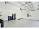 Spacious garage with epoxy floors, ample storage space, and modern utilities at 10418 Spring Tide Way, Parrish, FL 34219