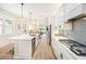 Bright kitchen with white cabinetry, subway tile backsplash, and stainless steel appliances at 10418 Spring Tide Way, Parrish, FL 34219