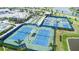 Community tennis courts featuring well-maintained courts and lush landscaping at 10418 Spring Tide Way, Parrish, FL 34219