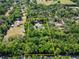 Aerial view showing the boundaries of the property, house, pool and surrounding woods at 11120 Lu Wista Ln, Brooksville, FL 34601
