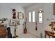 Bright foyer featuring a tiled floor, decorated walls, and front door access at 11120 Lu Wista Ln, Brooksville, FL 34601