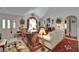 An open-concept living room features decoratively styled furniture, with a view to another room at 11120 Lu Wista Ln, Brooksville, FL 34601