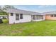 Backyard of the property with a well maintained lawn at 11723 Boynton Ln # 1, New Port Richey, FL 34654