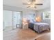 Bright bedroom featuring a neutral color palette, sliding glass doors, and ample natural light at 11723 Boynton Ln # 1, New Port Richey, FL 34654