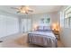 Bright bedroom featuring a neutral color palette, sliding glass doors, and ample natural light at 11723 Boynton Ln # 1, New Port Richey, FL 34654
