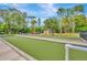 Enjoy outdoor recreation with this meticulously maintained bocce ball court, complete with seating and landscaping at 11723 Boynton Ln # 1, New Port Richey, FL 34654